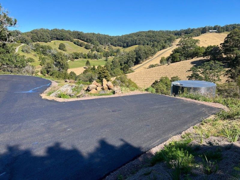 A Road With A View Of A Valley And Trees — Roll Formed Driveways in Maryborough, QLD
