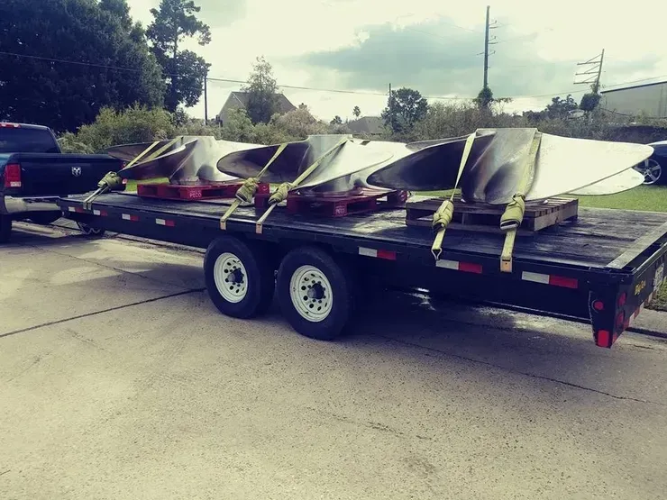 A trailer with a bunch of pieces of metal on it