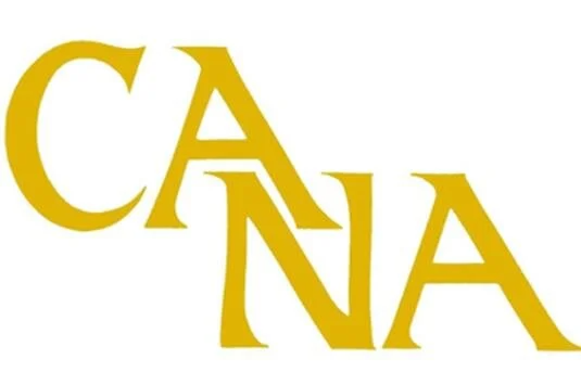 A yellow cana logo on a white background