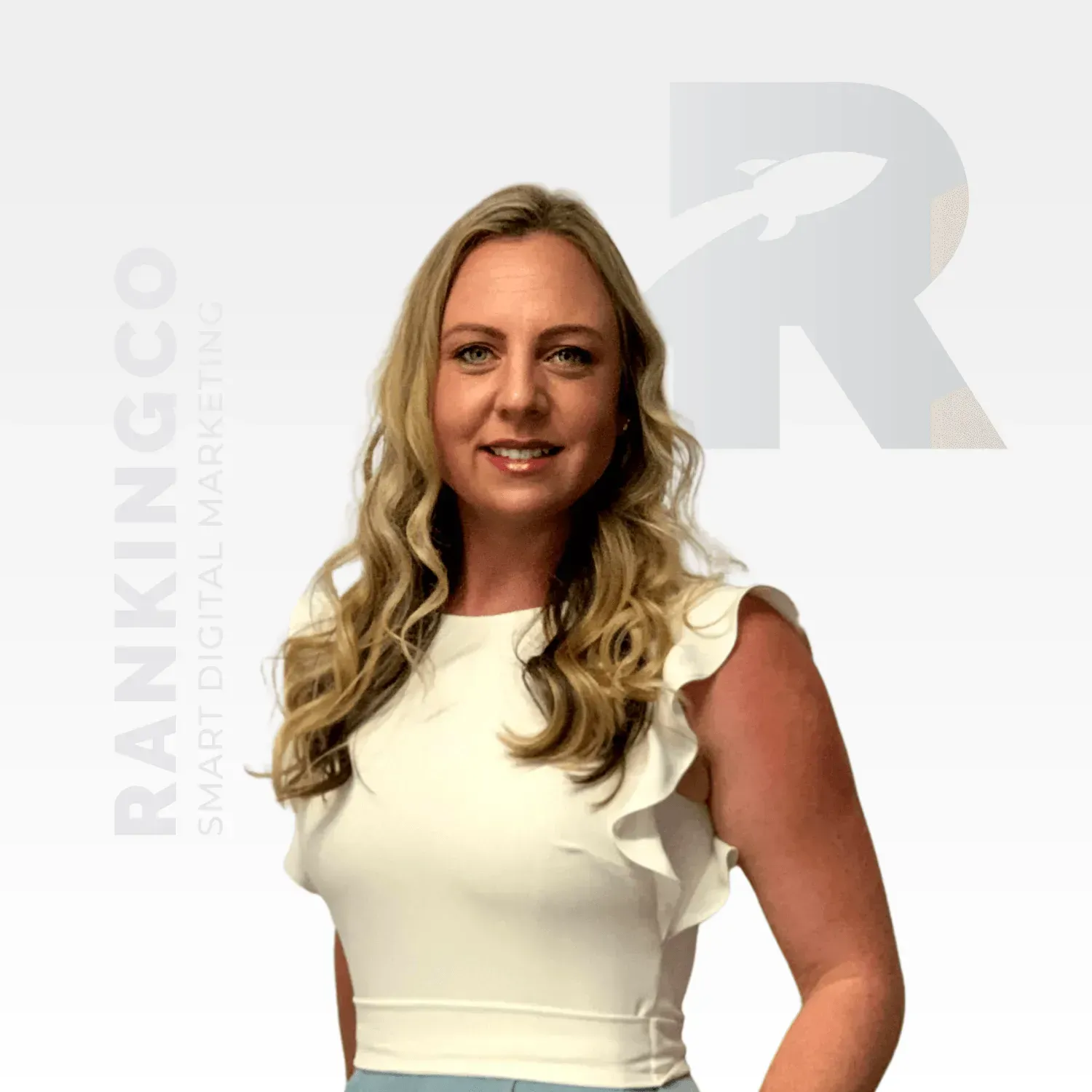 A woman in a white top is standing in front of a sign that says ranking co