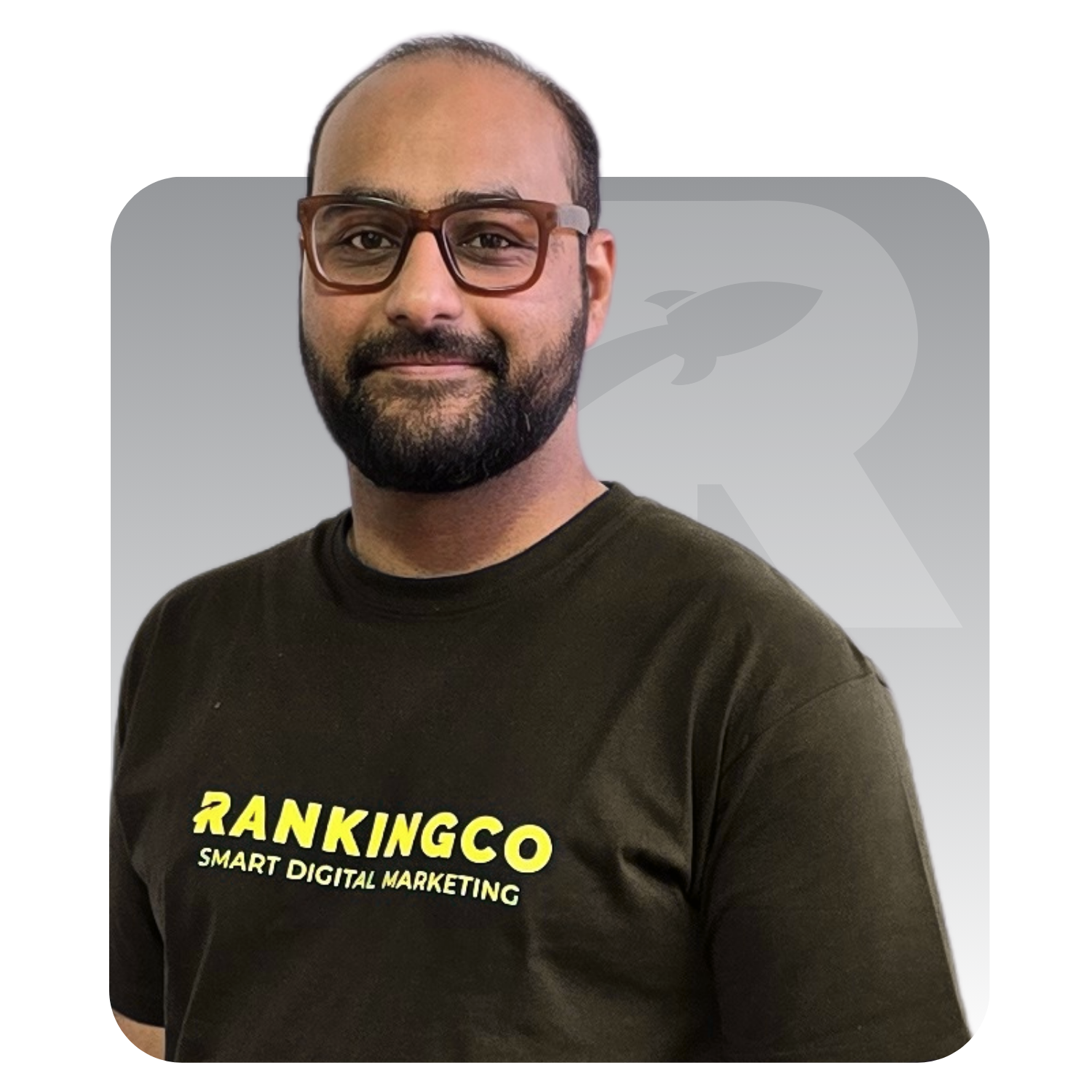 A man wearing glasses and a black shirt that says rankingco