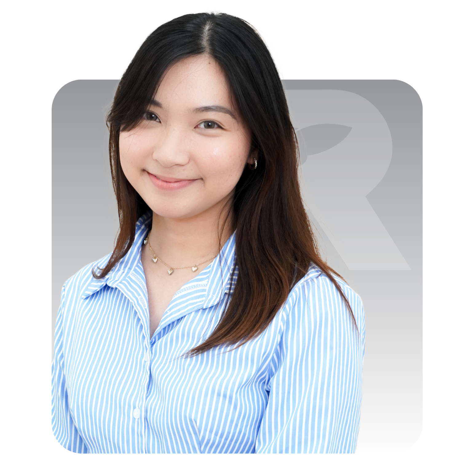A woman in a blue striped shirt is smiling for the camera