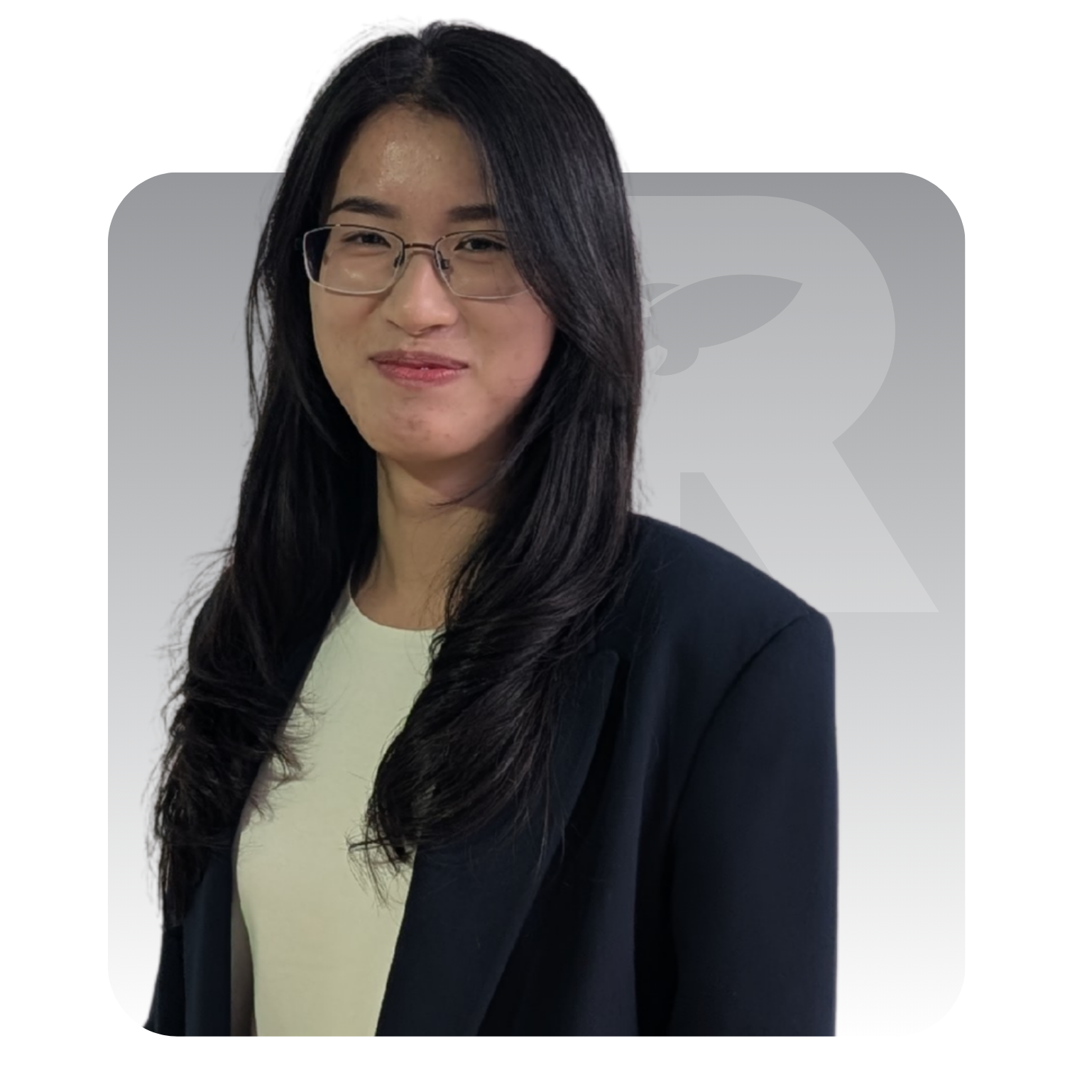A woman wearing glasses and a black jacket is standing in front of a sign that says ranking co