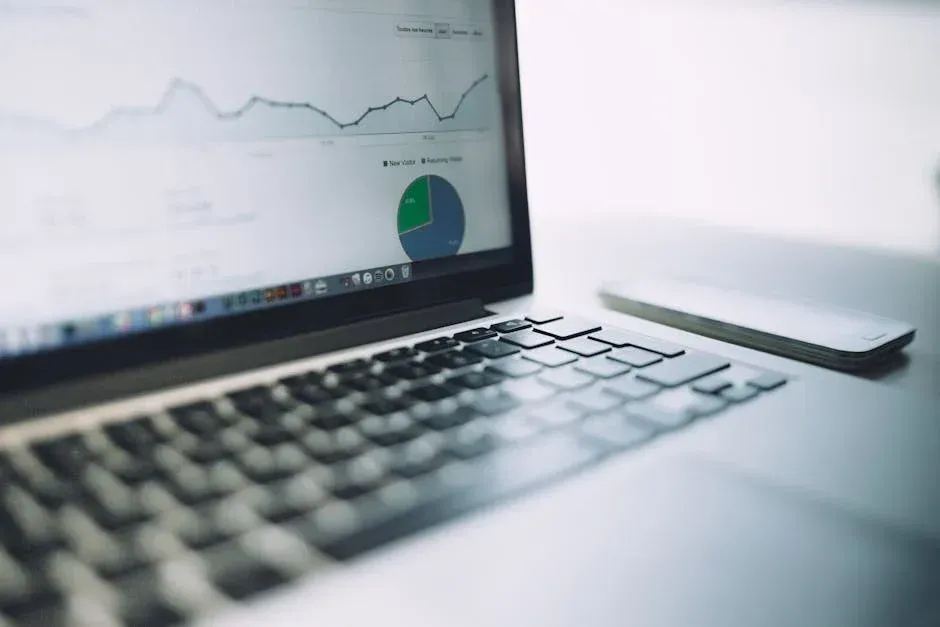 A laptop computer is open to a graph on the screen.
