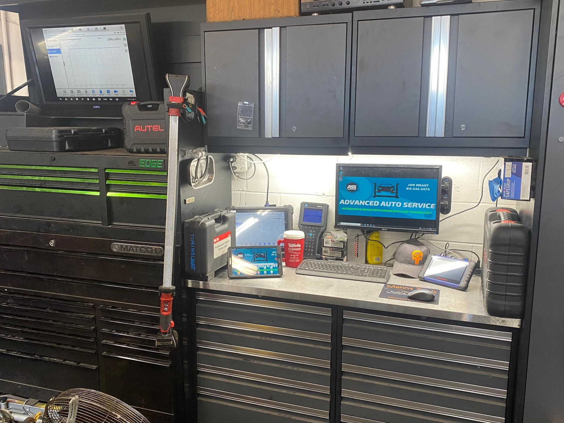 Well-Organized Mechanic's Workspace with Cabinets | Advanced Auto Service