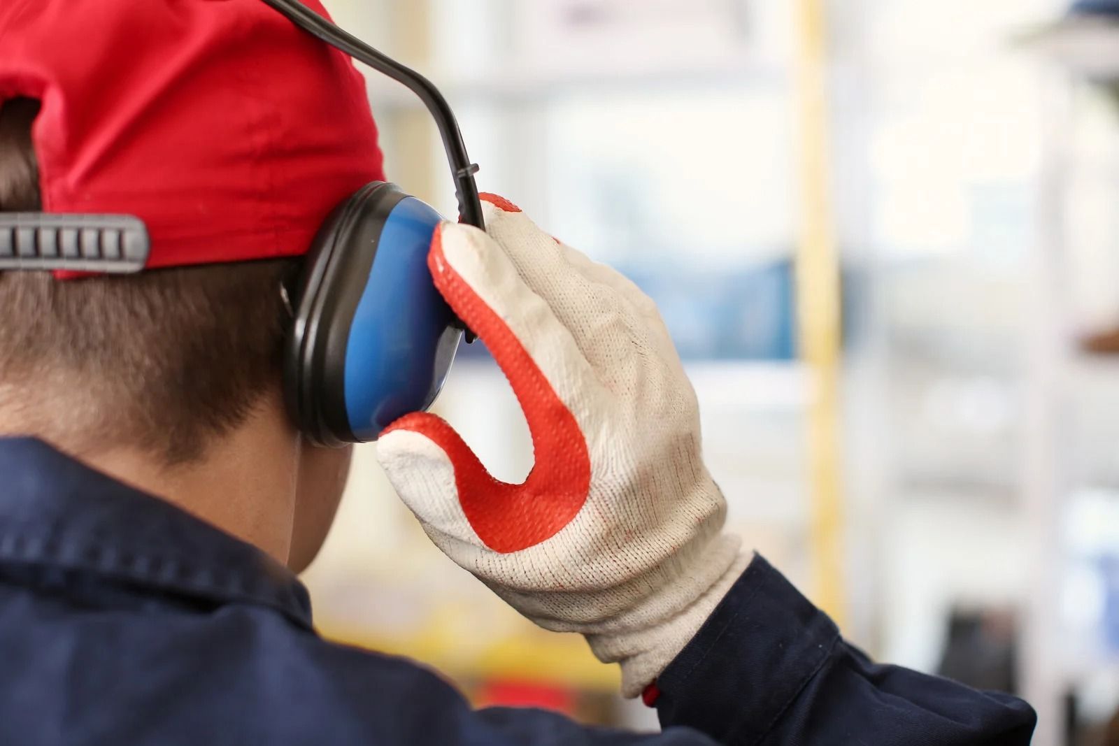 Man putting on hearing protection