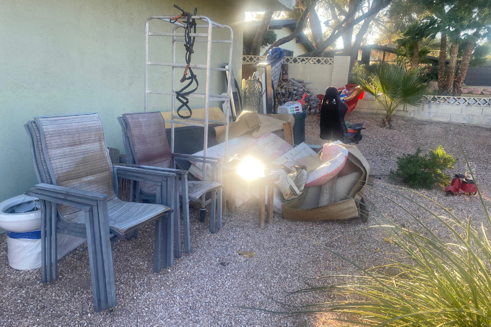 Junk removal, patio chairs , boxes, 
a table , and a ladder.