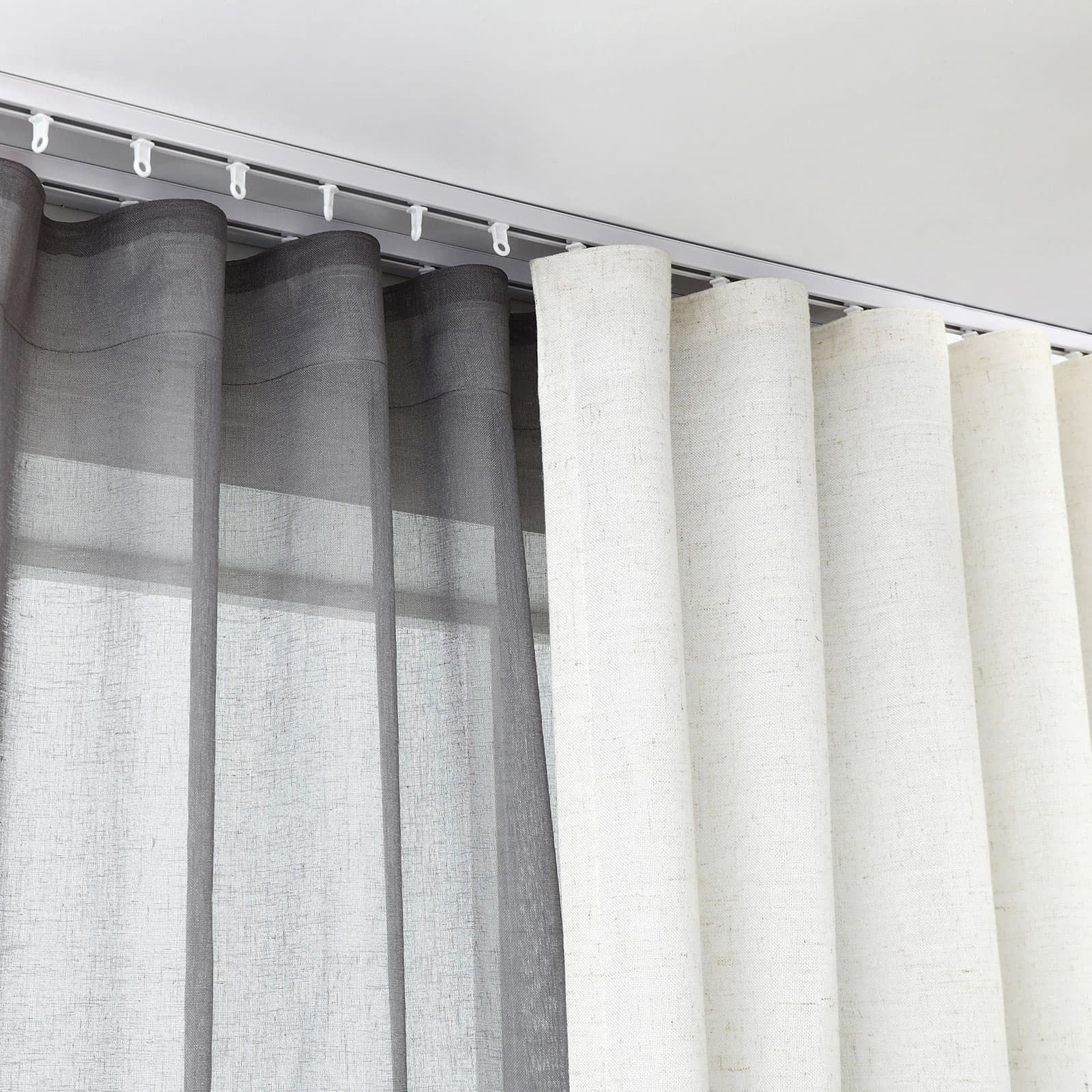 A Living Room with A Couch, Curtains and A Large Window — Mi-ekka Designs in Cannonvale, QLD