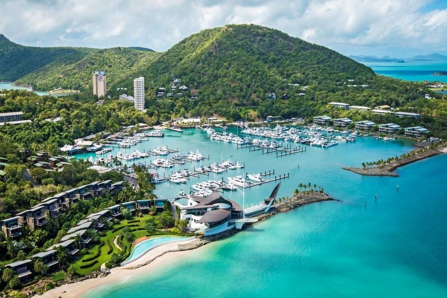 A Small Island in The Middle of A Large Body of Water Surrounded by Mountains — Mi-ekka Designs in Airlie Beach, QLD