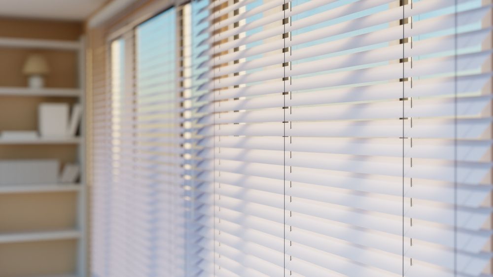 A Close up of a Window with Wooden Blinds on it — Mi-ekka Designs in Cannonvale, QLD