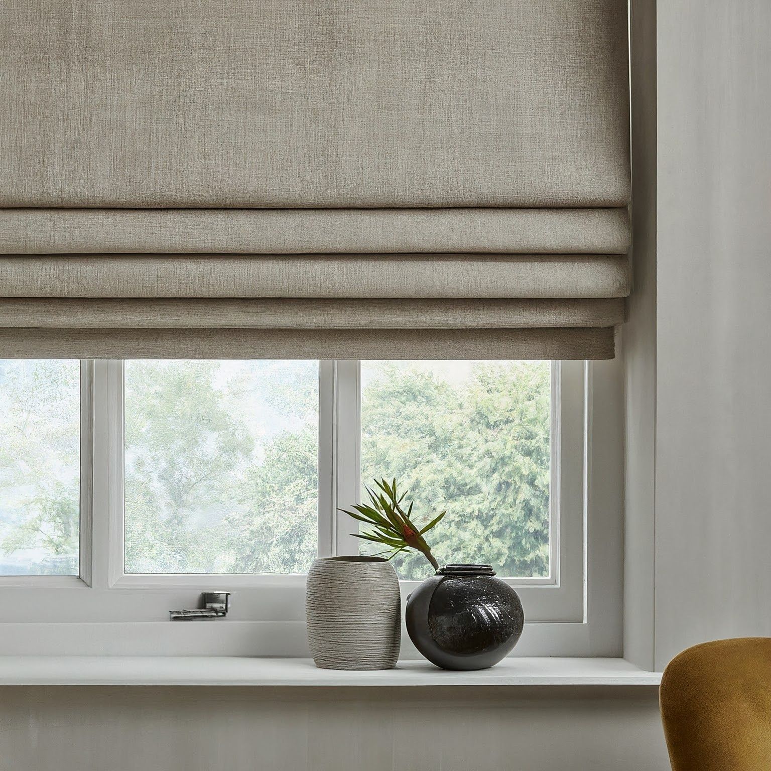 A Window With a Roman Blind and a Vase on the Window Sill — Mi-ekka Designs in Cannonvale, QLD
