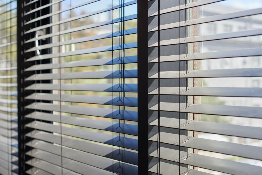 A Close Up of a Window With Blinds on It — Mi-ekka Designs in Cannonvale, QLD