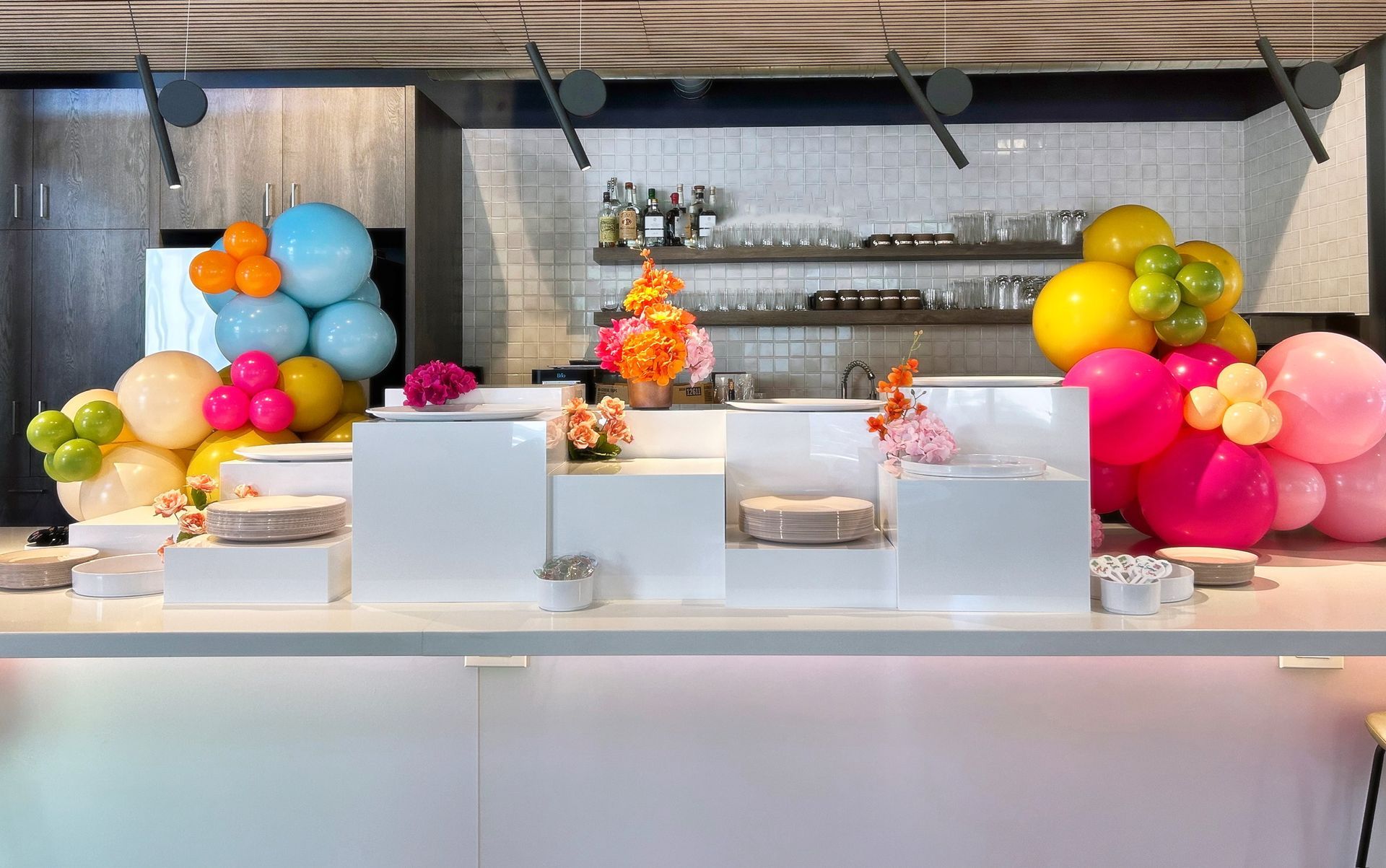 food risers all white displayed on a bar top for food styling