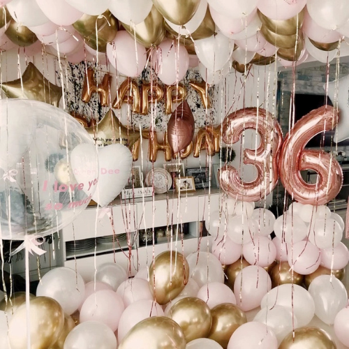 Pink and gold birthday balloons with 