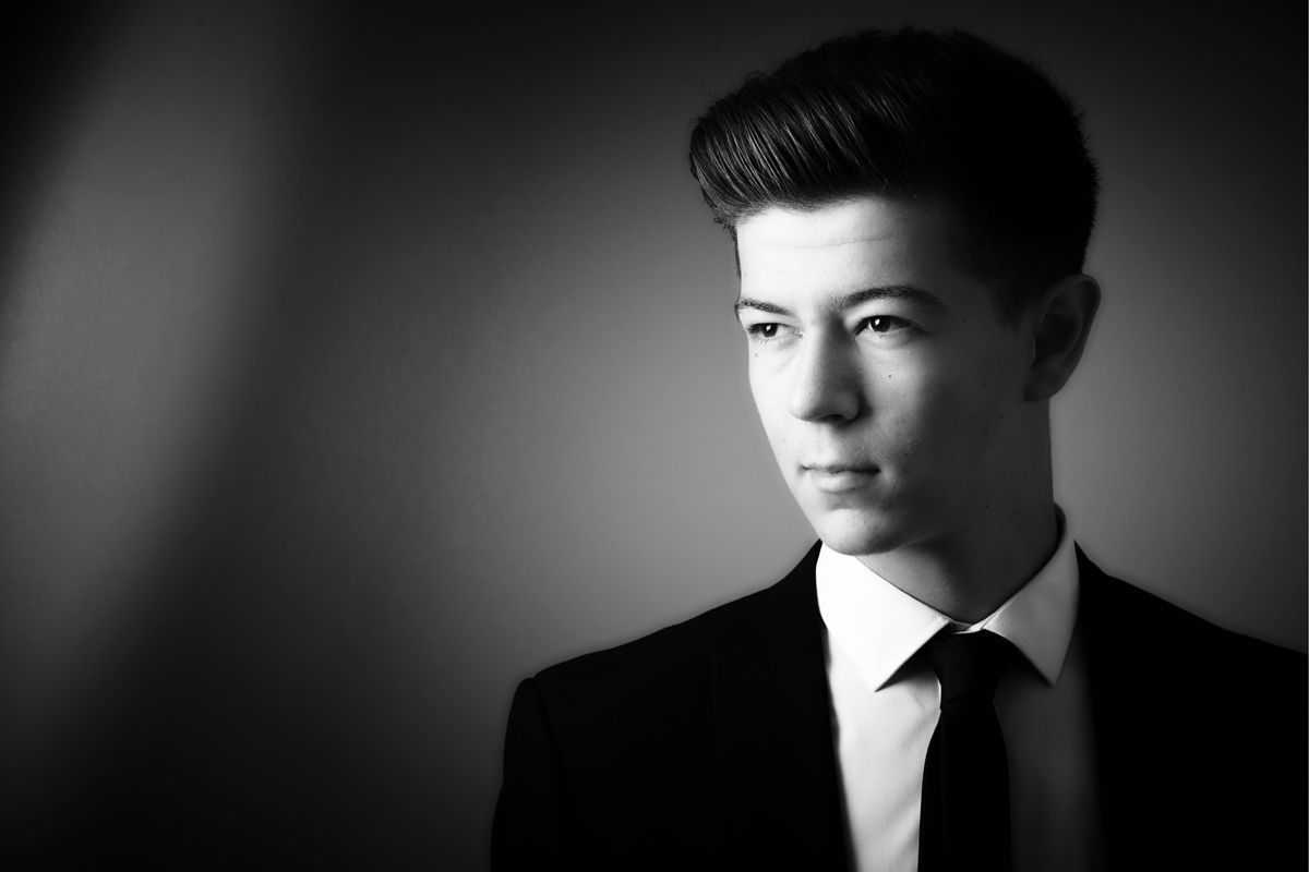 Young man in smart outfit posing for a solo prom photoshoot at Oakley Studios, Luton and Dunstable border