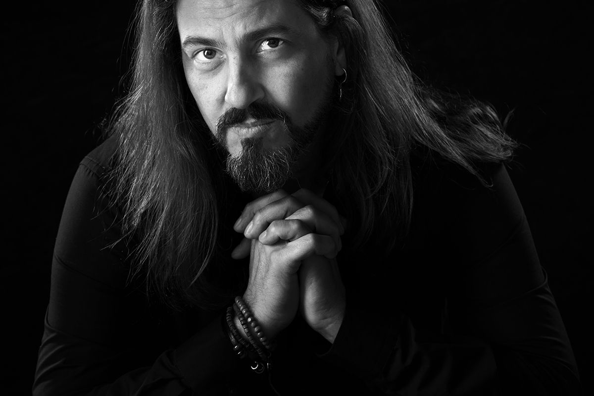 Professional headshot of a man with long hair taken at Oakley Studios on the Luton and Dunstable border