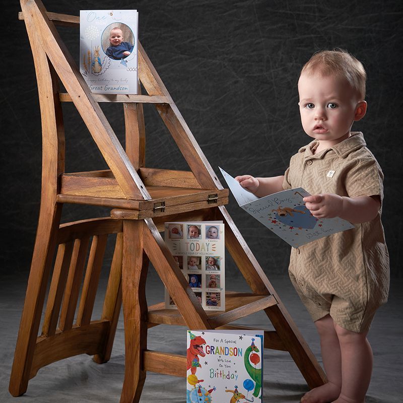 Toddler boy standing confidently on a wooden ladder — Watch Me Grow 12-18 month session, Oakley Studios near Luton and Dunstable