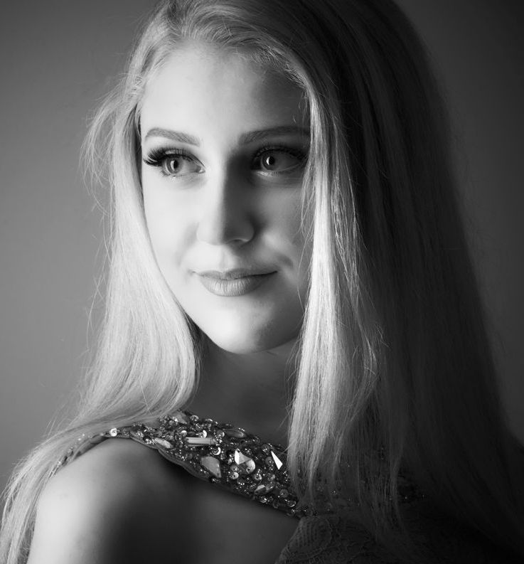 Young woman with blonde hair posing for a prom photoshoot at Oakley Studios, Luton and Bedfordshire