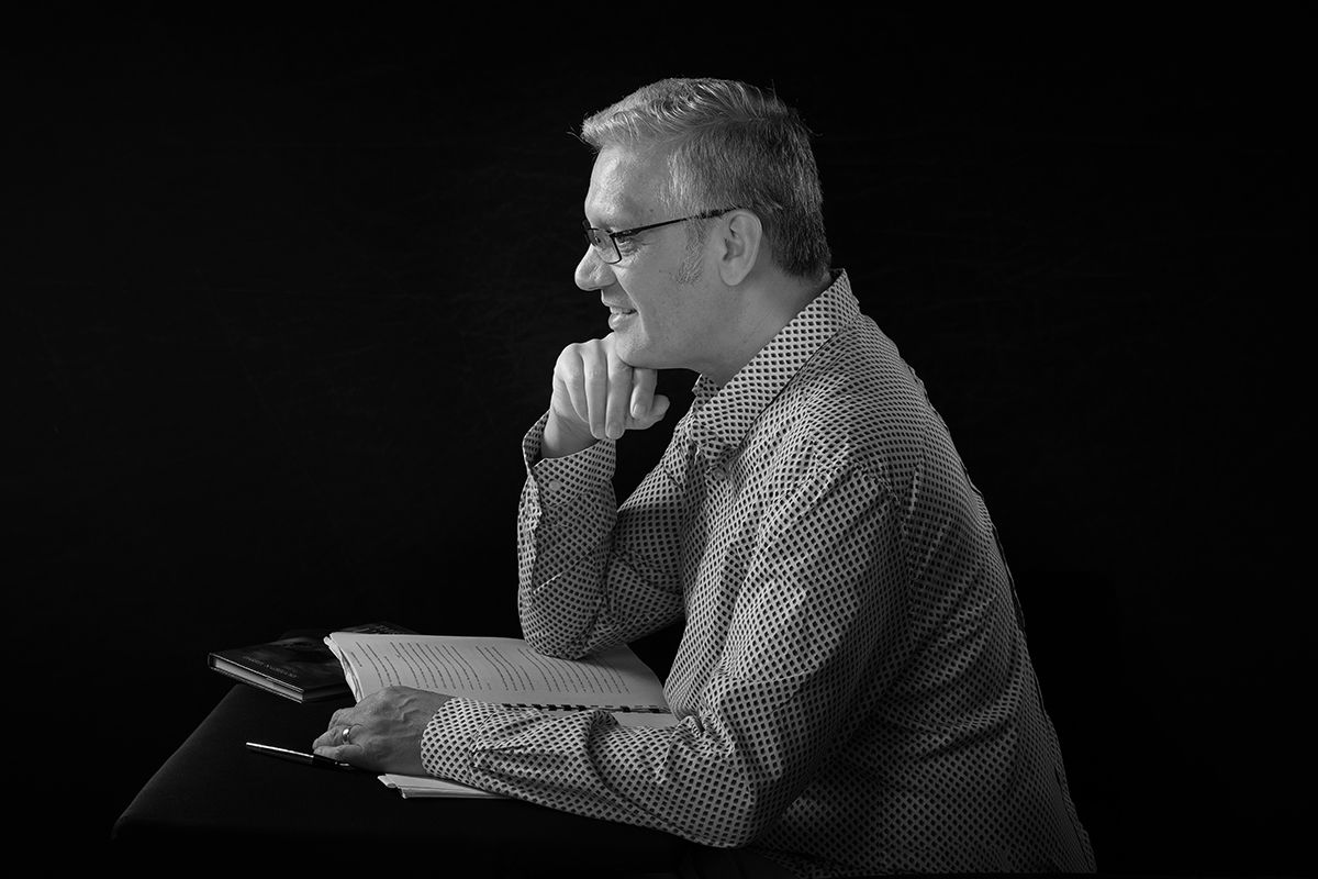 Author Darrell Gregory thinking pose with hand on chin — professional headshot by Oakley Studios, Luton