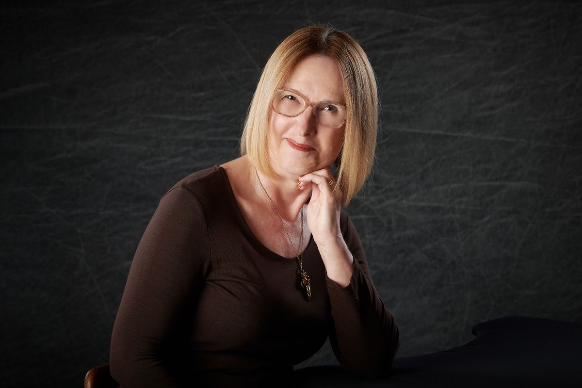 Professional headshot of a woman posing for a business portrait at Oakley Studios, Luton and Bedfordshire