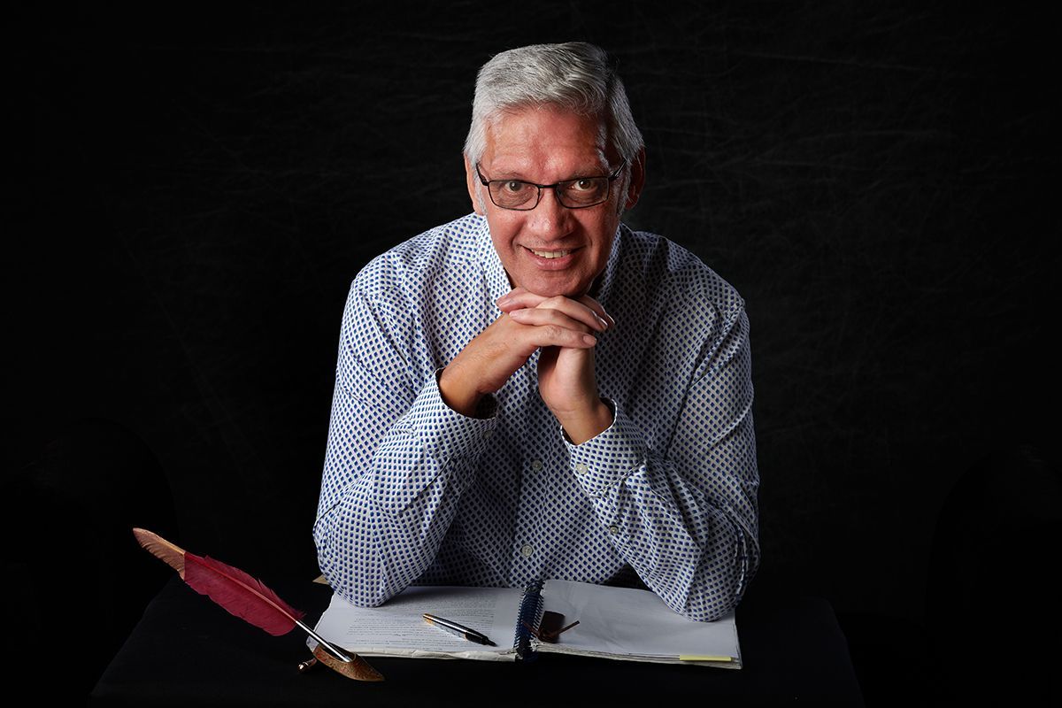 Author Darrell Gregory writing in his notebook — author headshot session at Oakley Studios, Luton and Dunstable border