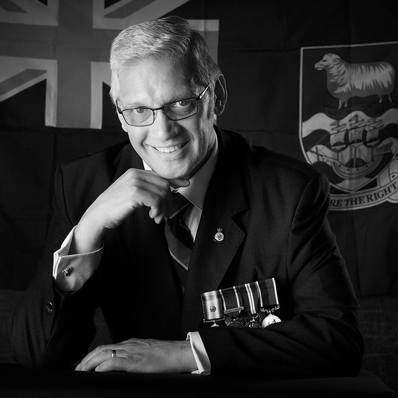 Darrell Gregory black and white author headshot in suit and tie — by David Doyle at Oakley Studios, Luton