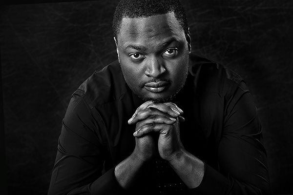 Young man posing for a solo portrait session at Oakley Studios on the Luton and Dunstable border
