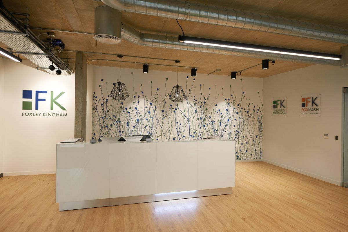 Foxley Kingham team at the reception desk — office branding photography by Oakley Studios, Luton and Bedfordshire