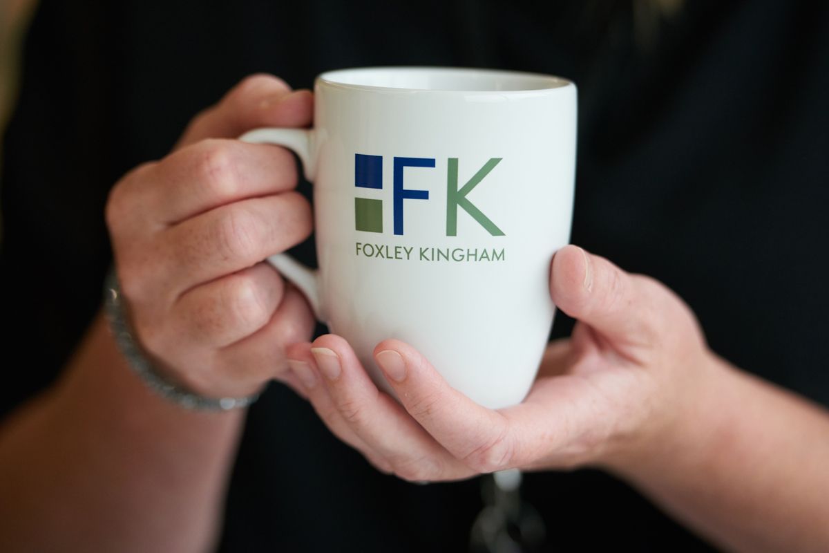 Foxley Kingham Accountants — member of staff holding a mug with corperate branding on it. Corporate branding photography by Oakley Studios, Luton and Dunstable border