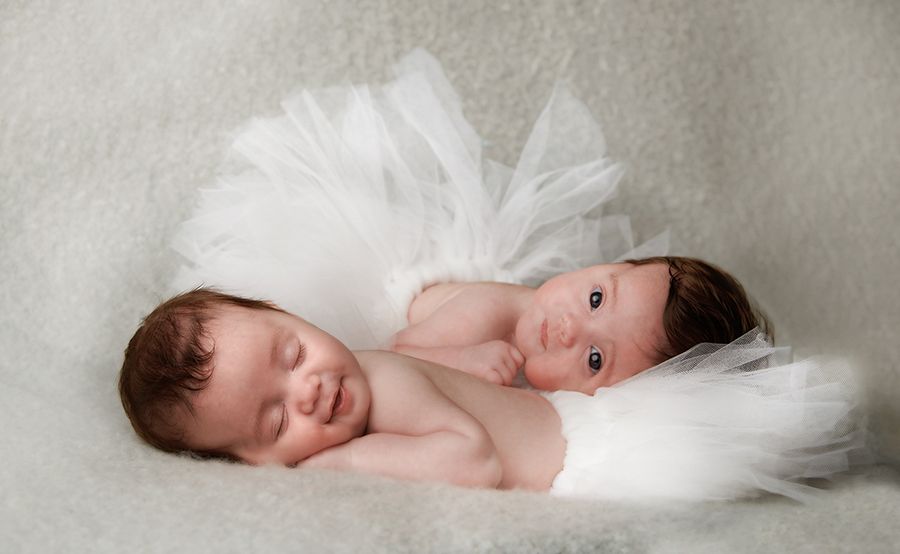 Sleeping newborn twins during a safe certified portrait session at Oakley Studios, Luton and Dunstable border