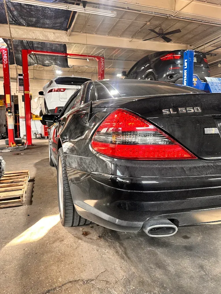 Black Mercedes-Benz S550 parked in a repair shop garage | Albeik Auto Service