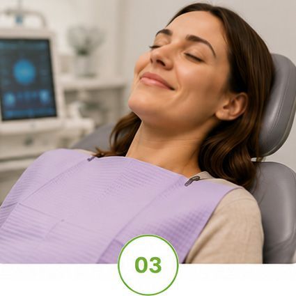 Woman reclining in a dentist chair with eyes closed, smiling, in a dental clinic