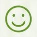 Green smiling face icon on a light background