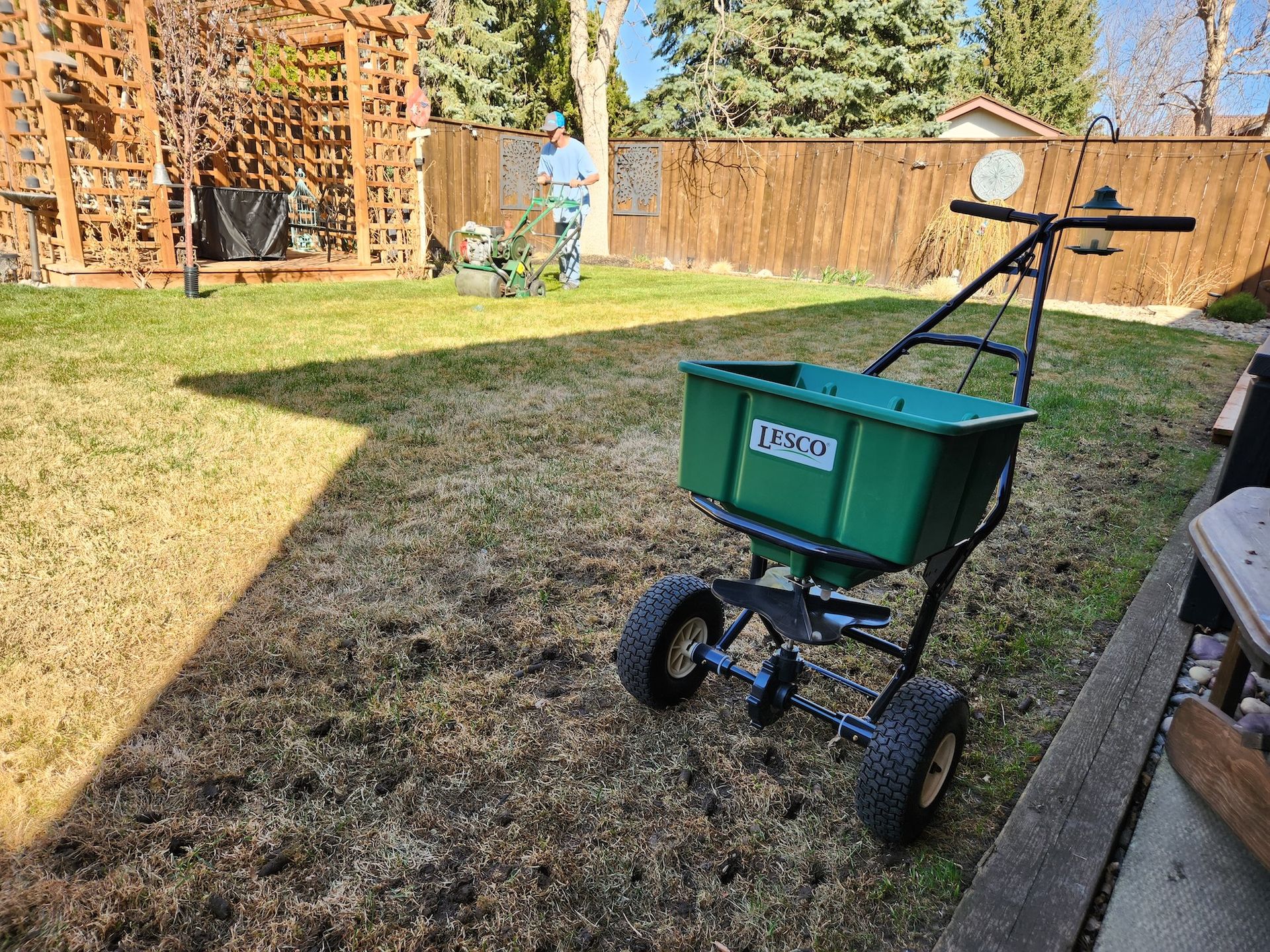 Green spreader on lawn.