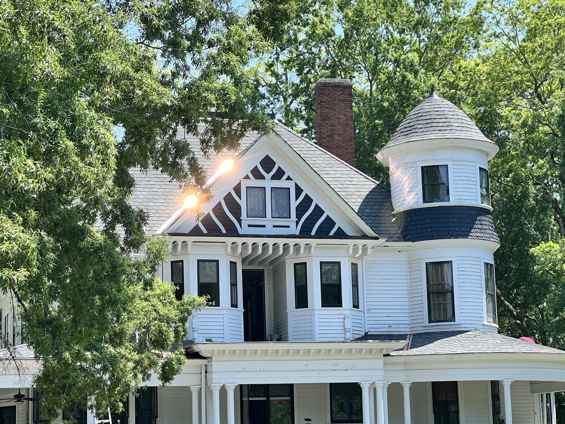 Victorian-style home in North Raleigh, NC with new roof installation, restored by Roof Dawgs roofing contractor.
