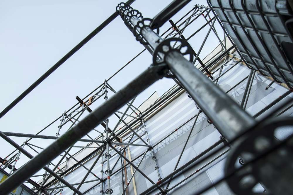 Looking Up At A Building With Scaffolding On It — Triple S Scaffolding In Port Macquarie, NSW