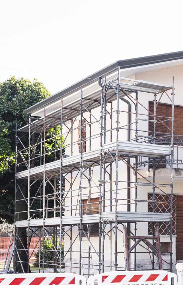 A House Is Being Built With Scaffolding Around It — Triple S Scaffolding In Port Macquarie, NSW