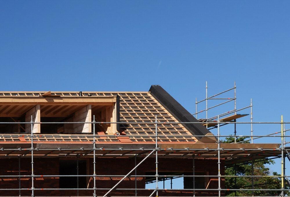 A House Under Construction With Scaffolding Around It — Triple S Scaffolding In Taree, NSW