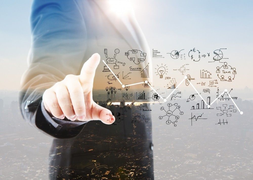 Businessperson pointing at a floating graph and business icons. City background.