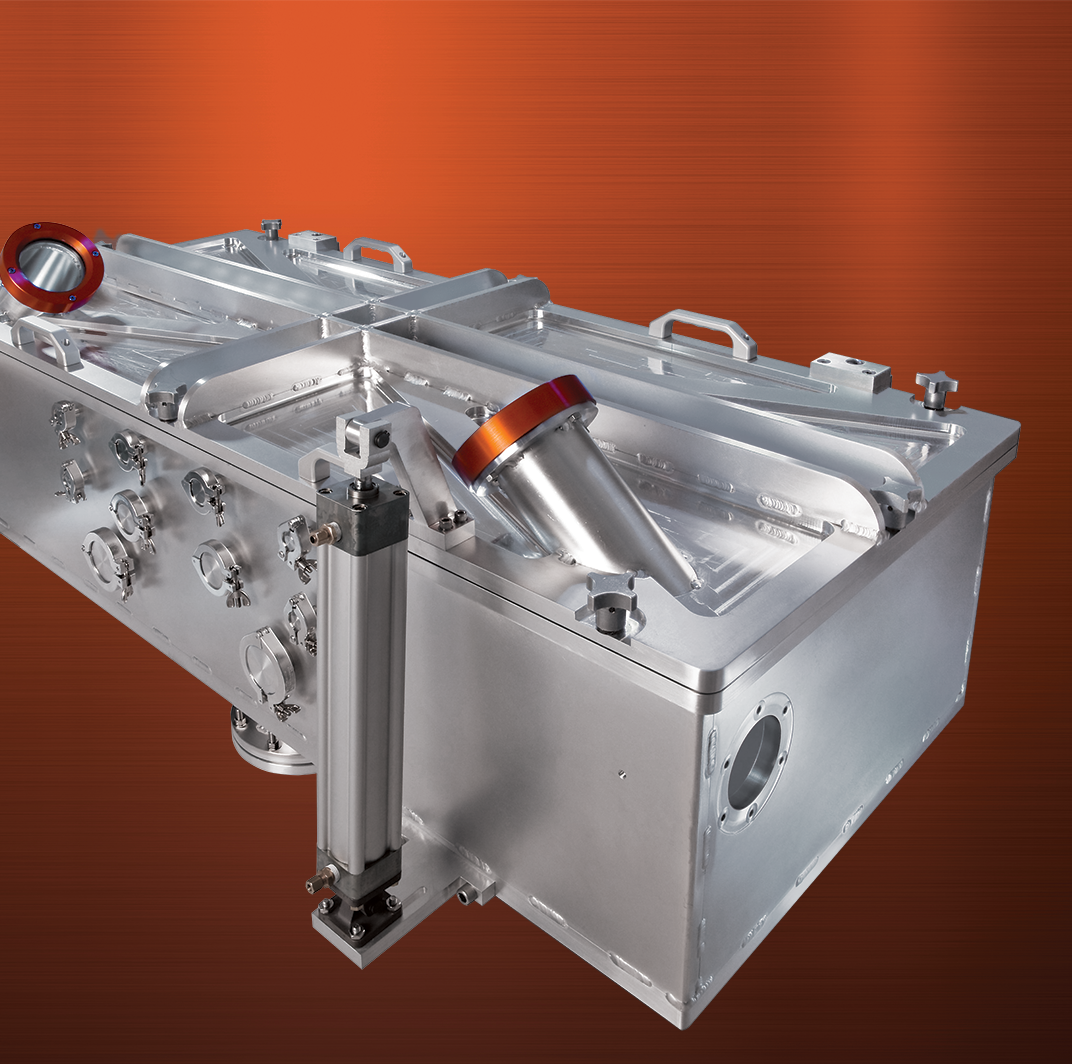 Rectangular aluminum chamber for NASA simulation of ballistics in planetary atmospheric conditions shown on orange metal.