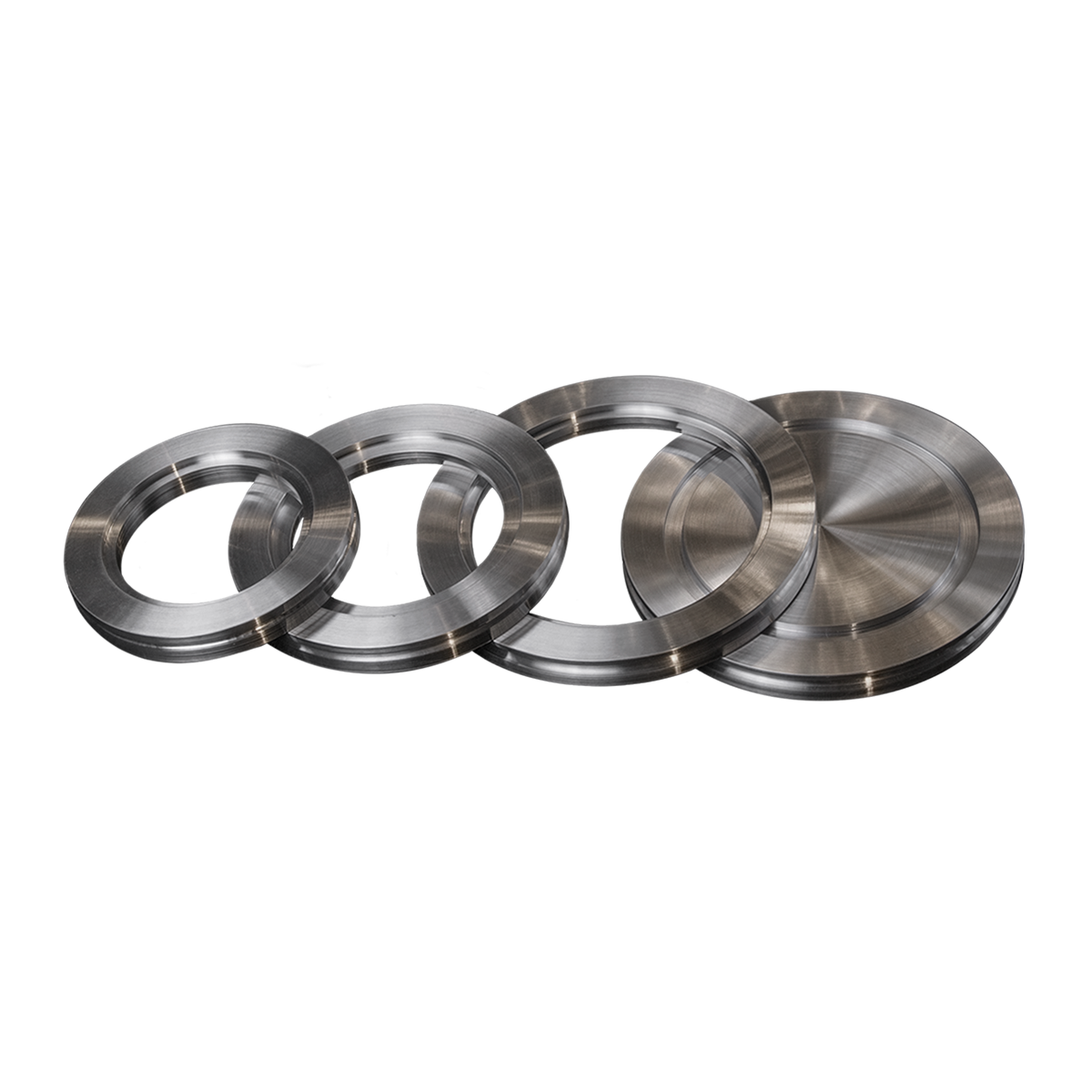 An assortment of circular high vacuum (HV) compatible ISO flanges, some blank and some with bore.