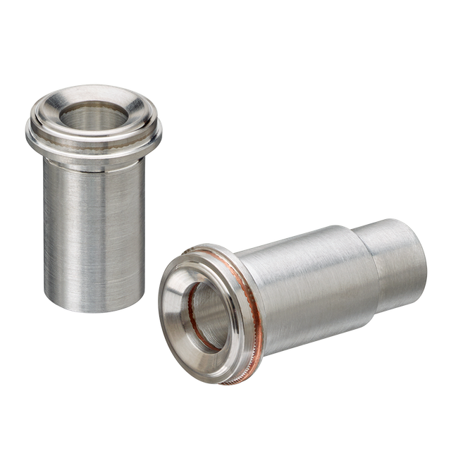 Two bimetal aluminum-stainless Face Seal Fittings (ATCRs) sitting next to each other on a white surface.