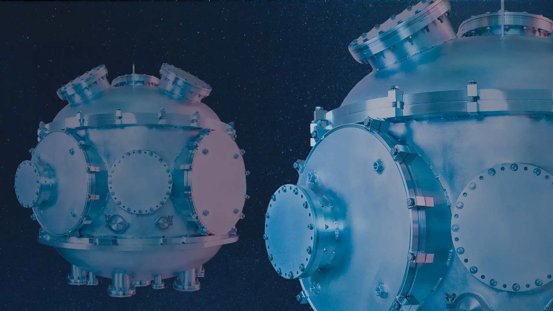 Two large spherical aluminum chambers with many flanges and view ports sized from 1.33