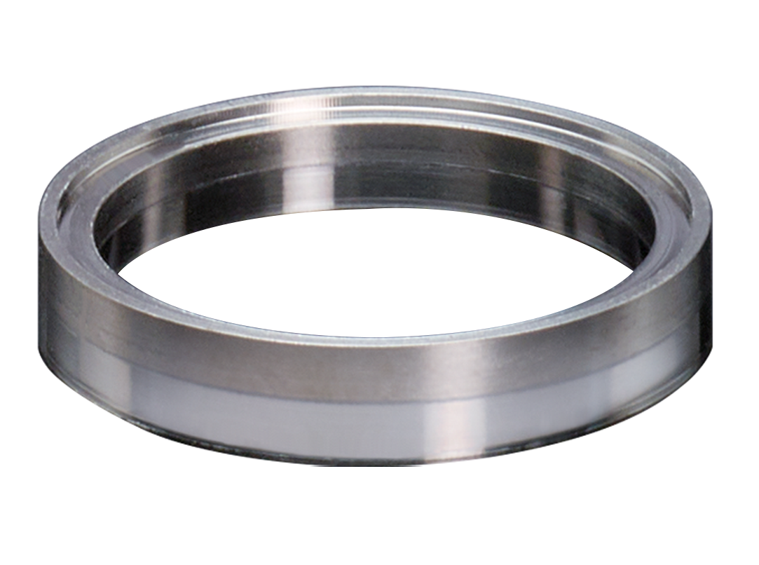 A custom bimetal titanium/stainless transition ring for coupling tubes.