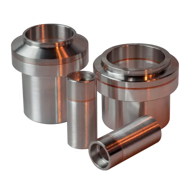Three bimetal Al-SS fittings in different sizes and configurations are cylinder shaped with larger diameter endfaces.
