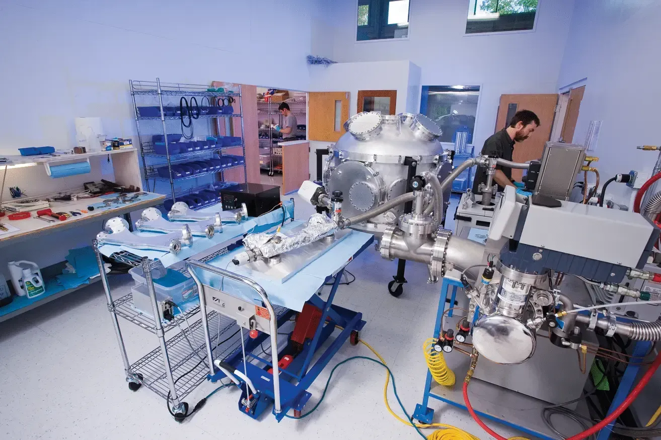 Atlas vacuum qualification room with a spherical chamber and multiple dipole chambers undergoing bakeout and leak testing. 
