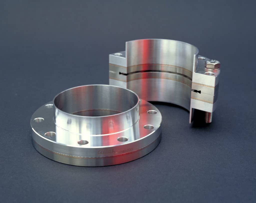 A cross section of two bimetal flanges bolted together with a separate bimetal flange shown in front.