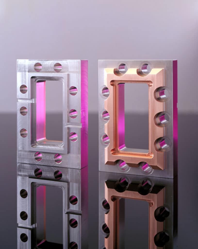 Rectangular bimetal copper-stainless flanges to mount radio frequency tuning apparatus. 