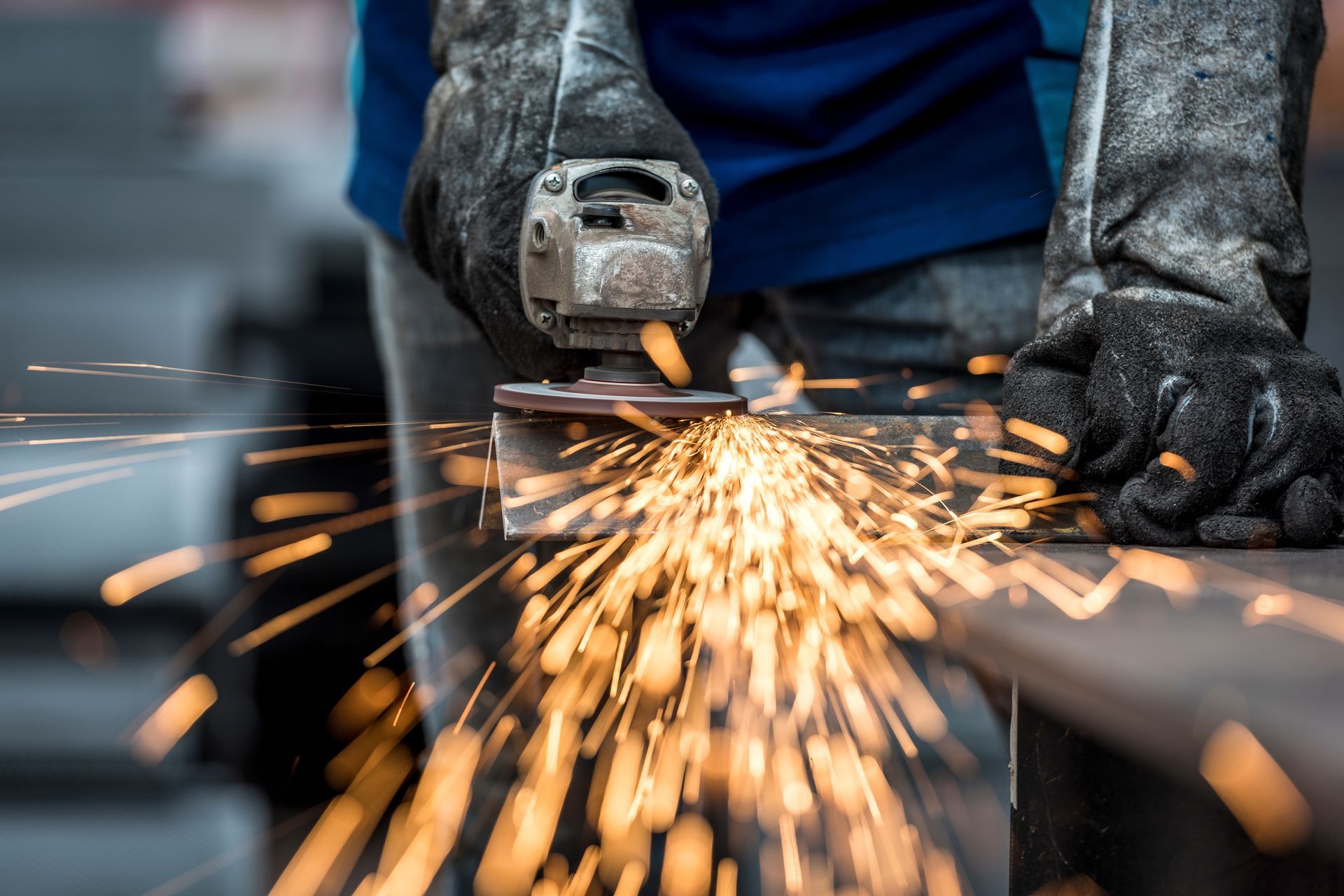 Closeup to the hands of a worker making some sheet metal fabrication. Closeup to the hands of a worker making some sheet metal fabrication.