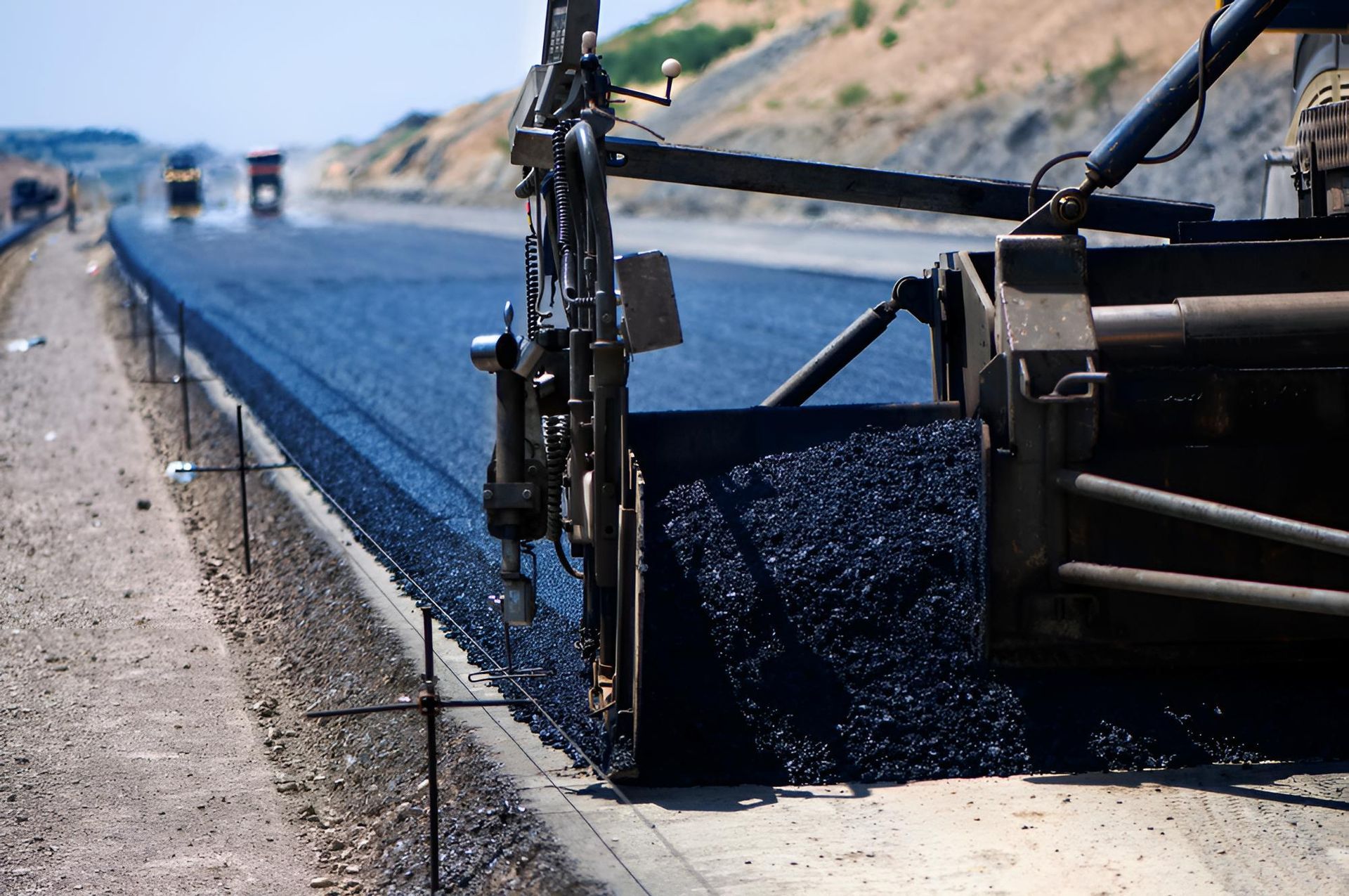 Bitumen Sealing a Road with a Machine — F & J Bitumen Services in Palmerston, NT